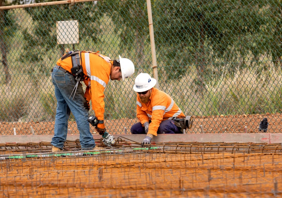Simmons worker preparing galvansied mesh