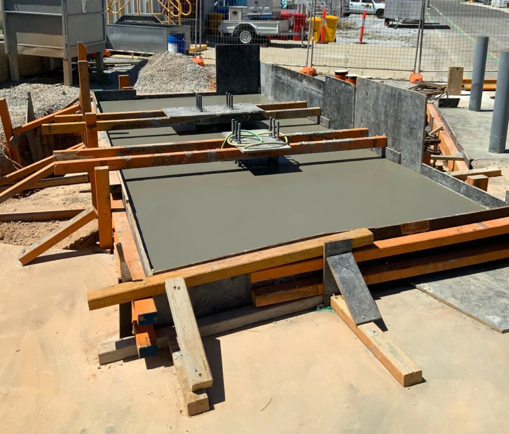 A concrete footing being set in formwork